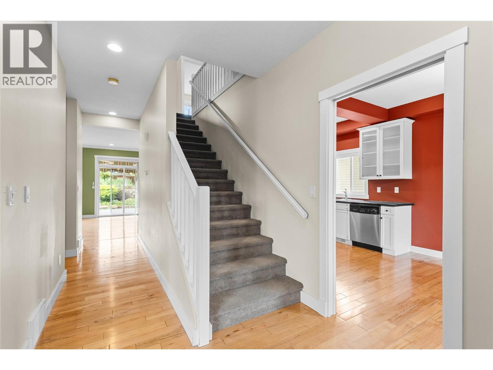 Stairs to upper level - 479 Middleton Way, Coldstream, BC - Indoor Photo Showing Other Room