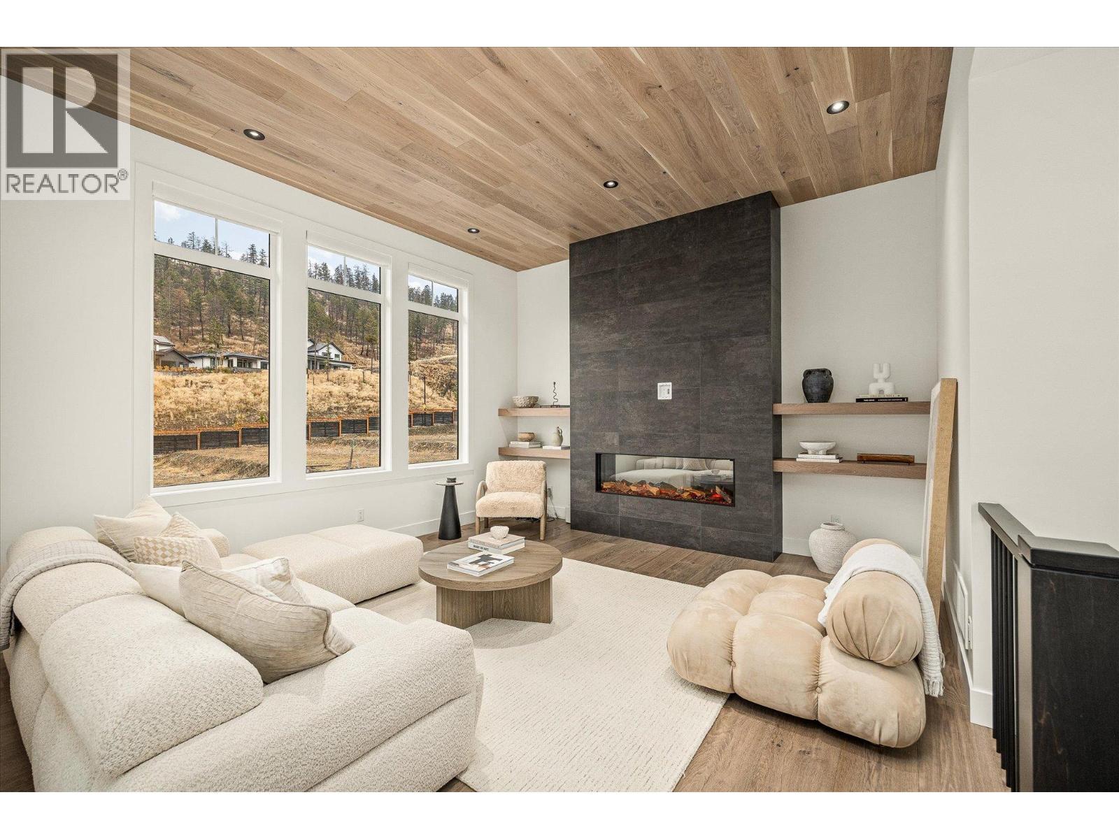 1437 April Springs Court, Kelowna, BC - Indoor Photo Showing Living Room With Fireplace