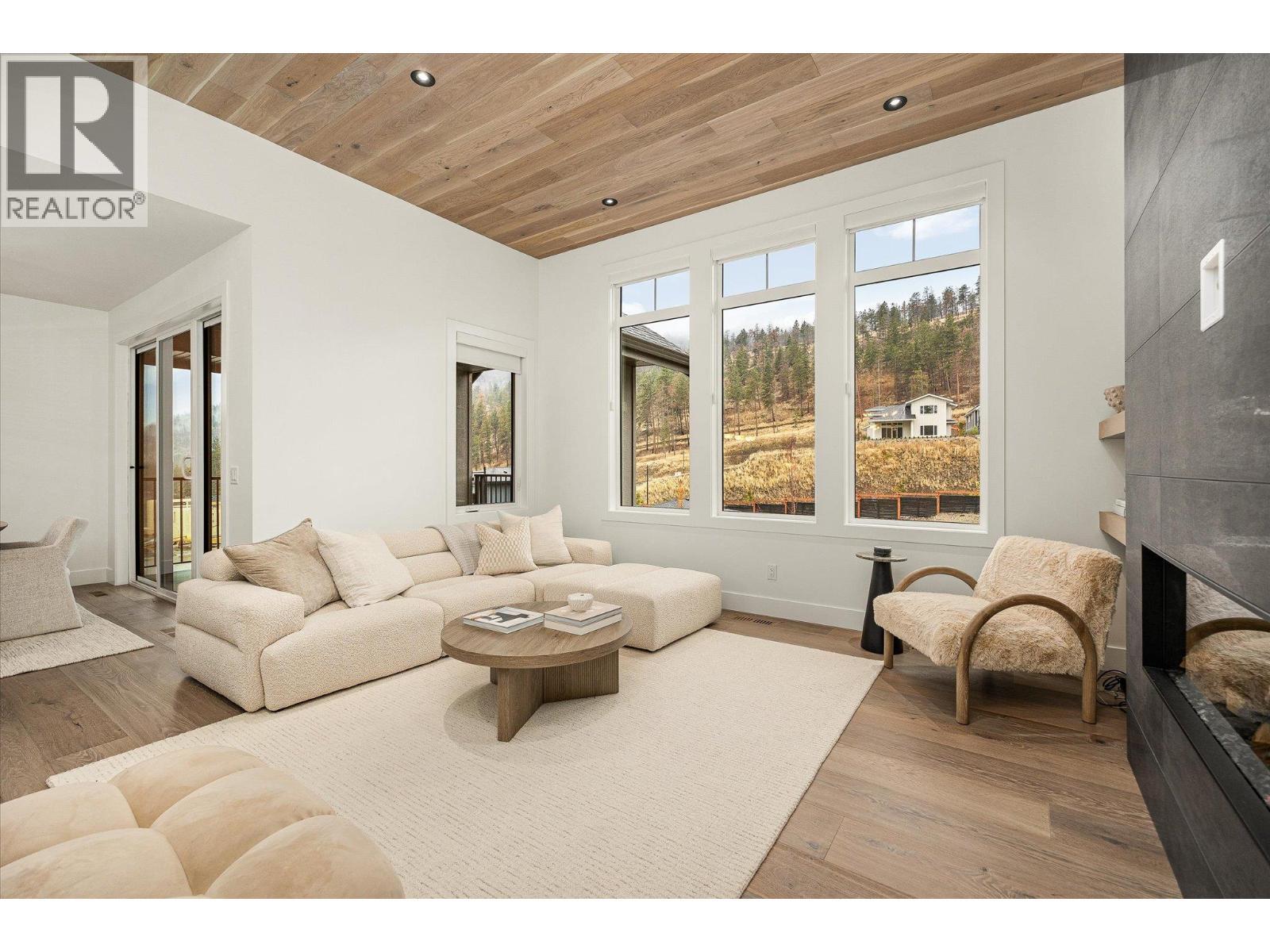 1437 April Springs Court, Kelowna, BC - Indoor Photo Showing Living Room With Fireplace