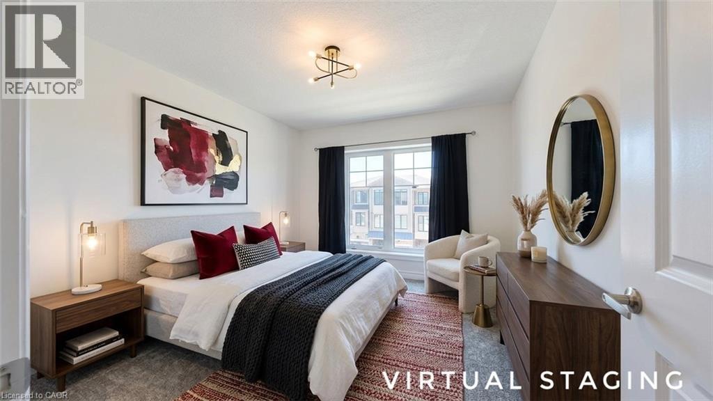 Bedroom featuring neutral wall paint, a modern ceiling light fixture, a large window with dark drapes, and plush carpet flooring - 10 Birmingham Drive Unit# 129, Cambridge, ON - Indoor Photo Showing Bedroom