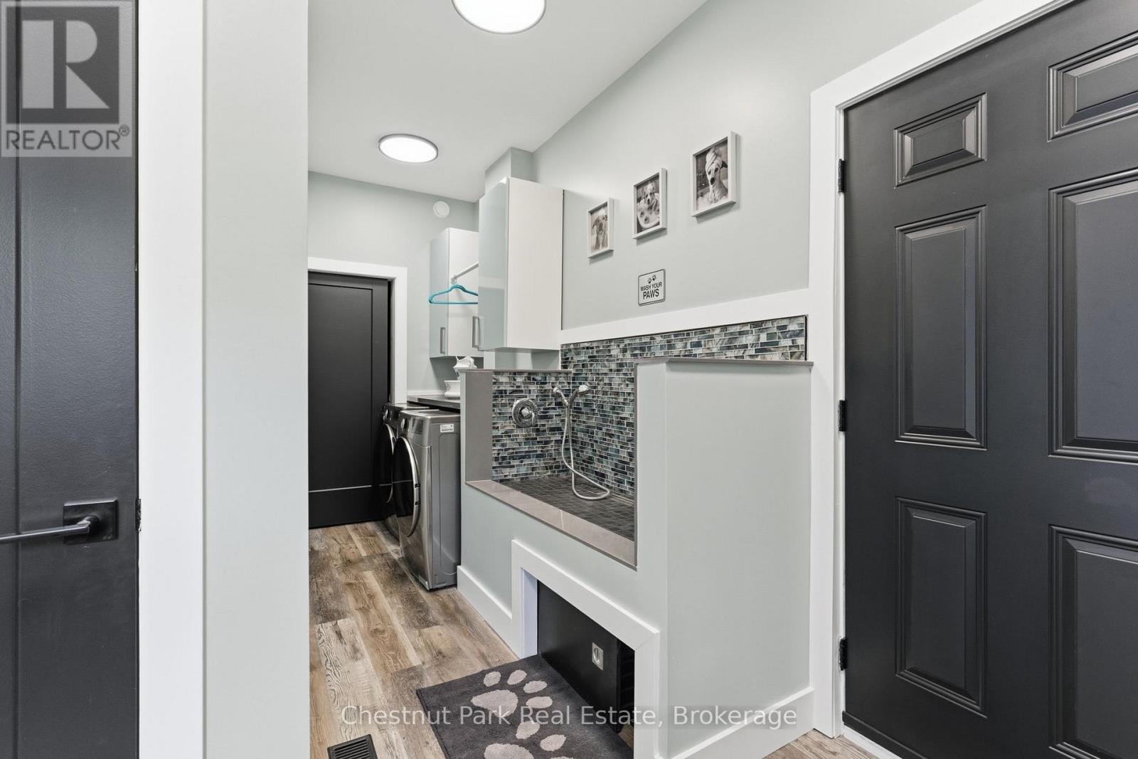 Pet wash station, laundry, and door to the garage - 149 Lynx Drive, Kearney, ON