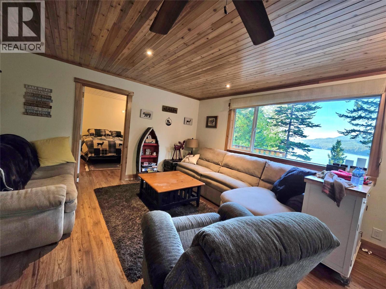Big windows with beautiful views of the lake - 6453 Pinaus Lake Road, Falkland, BC
