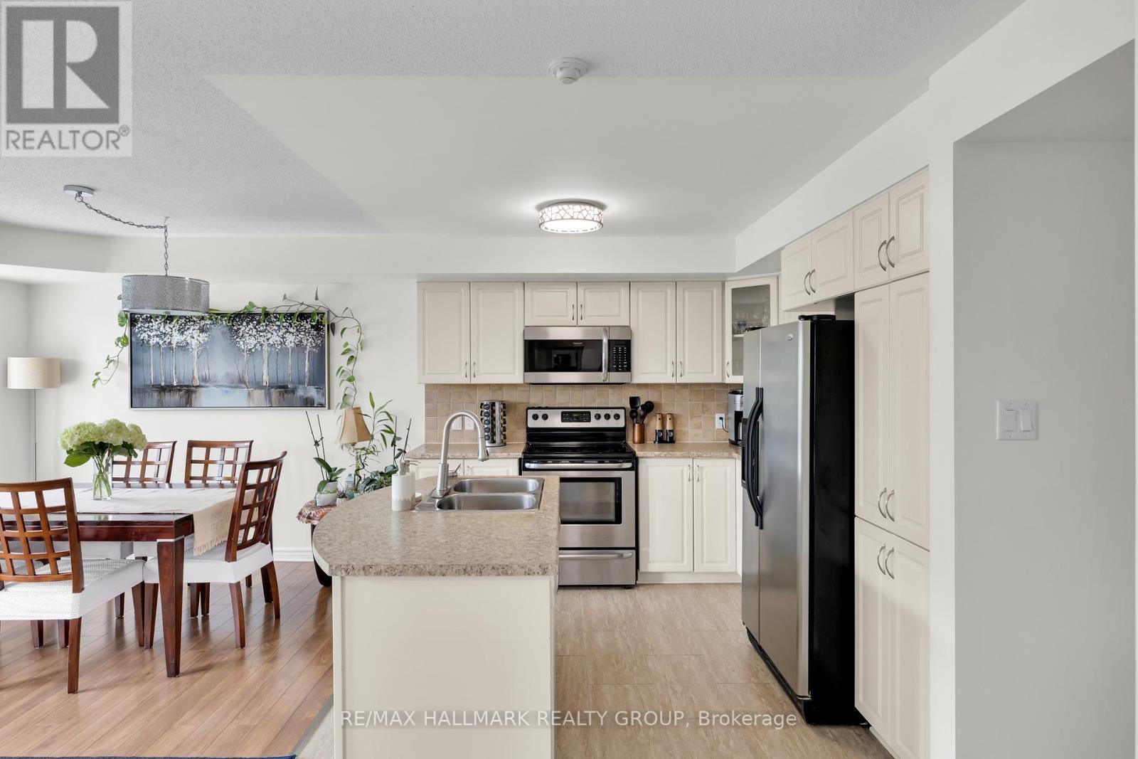 Spacious kitchen with stainless steel appliances. - 6 - 500 Stonefield Private, Ottawa, ON