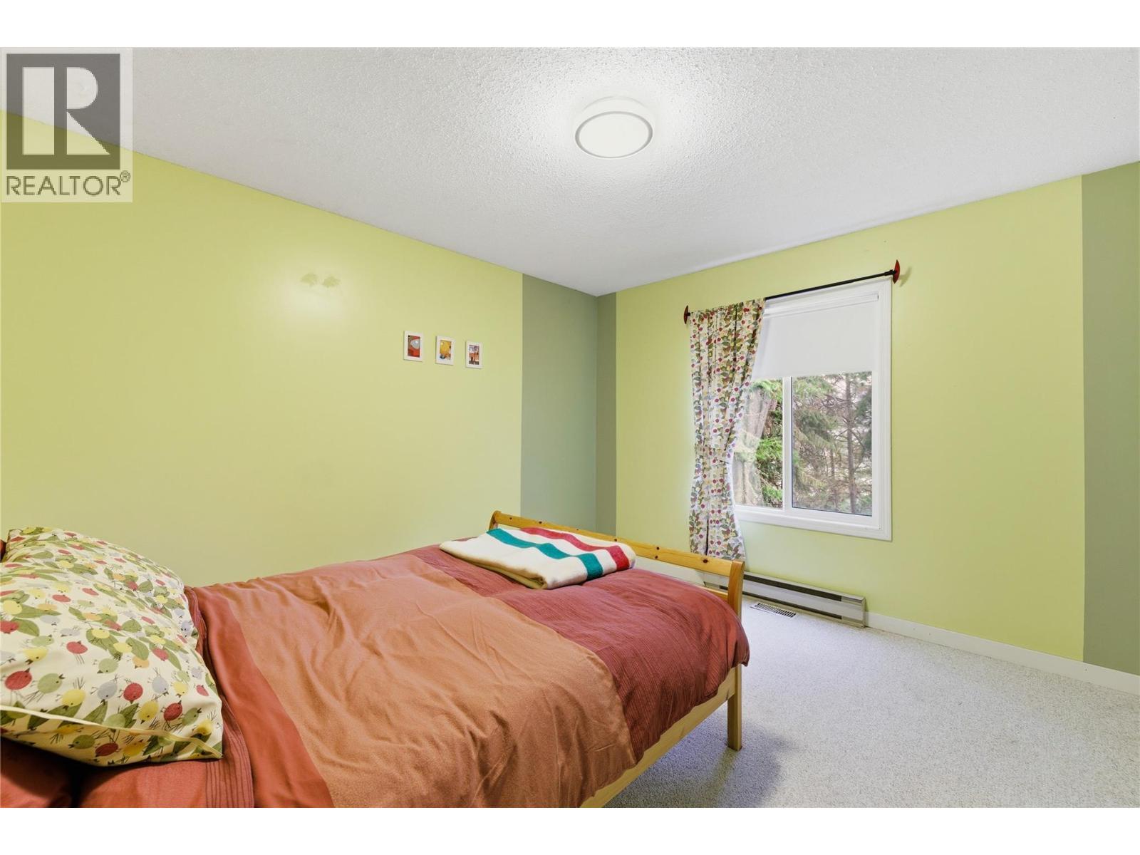 Bedroom on Main Floor - 324 Clifton Road N, Kelowna, BC