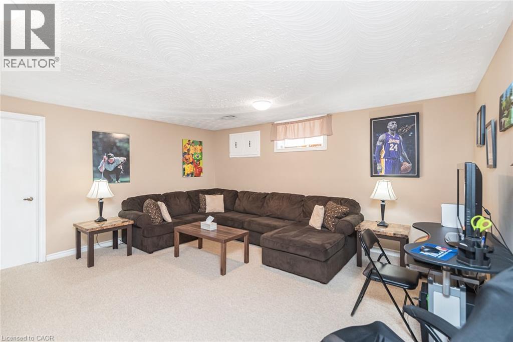 Recreation room featuring neutral-toned walls, recessed lighting, and light-colored carpeting - 366 Berkindale Drive, Hamilton, ON
