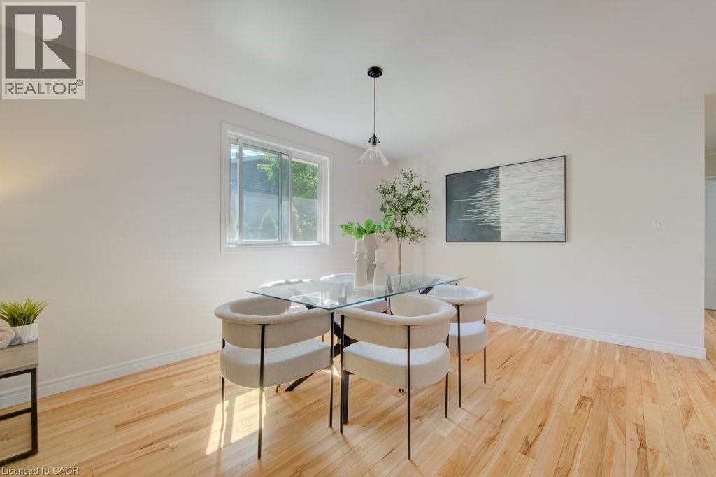 Bright interior space with light-toned walls and wood-finish flooring - 60 Mayfield Avenue, Waterloo, ON