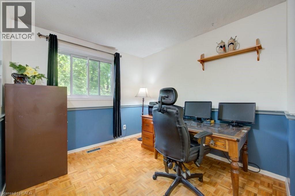 Parquet wood-finish flooring with a white and blue wall treatment - 60 Mayfield Avenue, Waterloo, ON