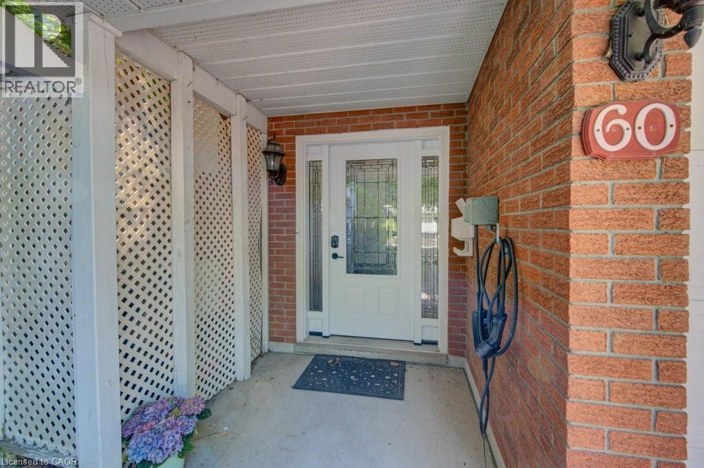 Brick facade with white latticework screens - 60 Mayfield Avenue, Waterloo, ON