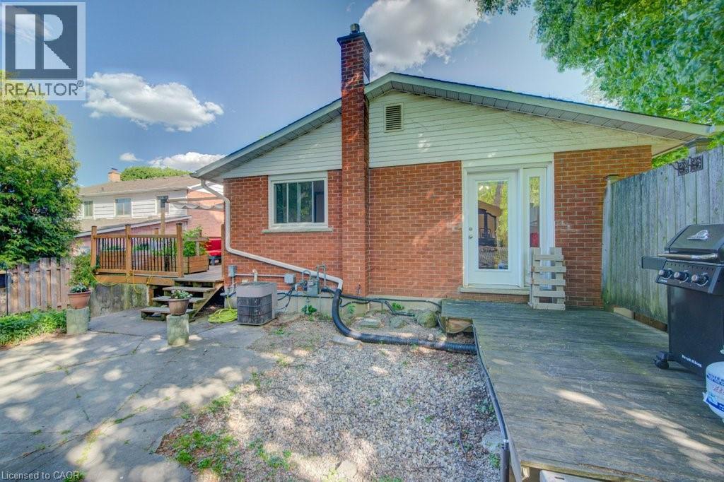 Brick exterior with white siding accents and a pitched roofline - 60 Mayfield Avenue, Waterloo, ON