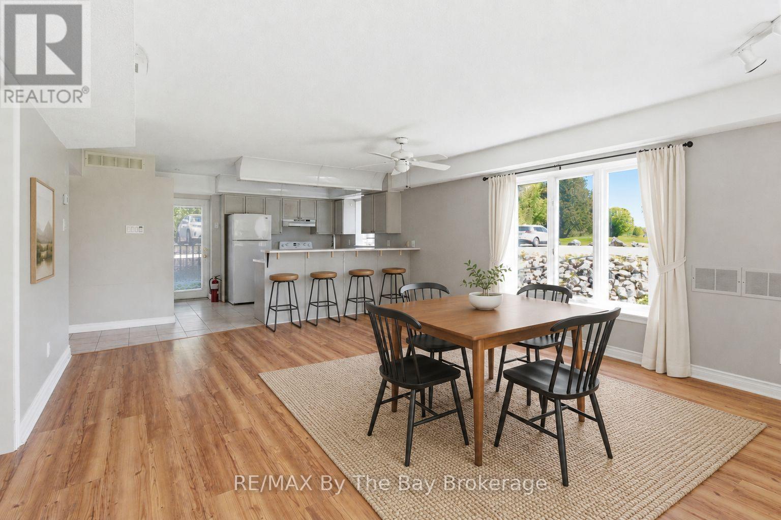 virtually staged dining room - 1 - 10 Mulligan Lane, Wasaga Beach, ON - Indoor Photo Showing Dining Room