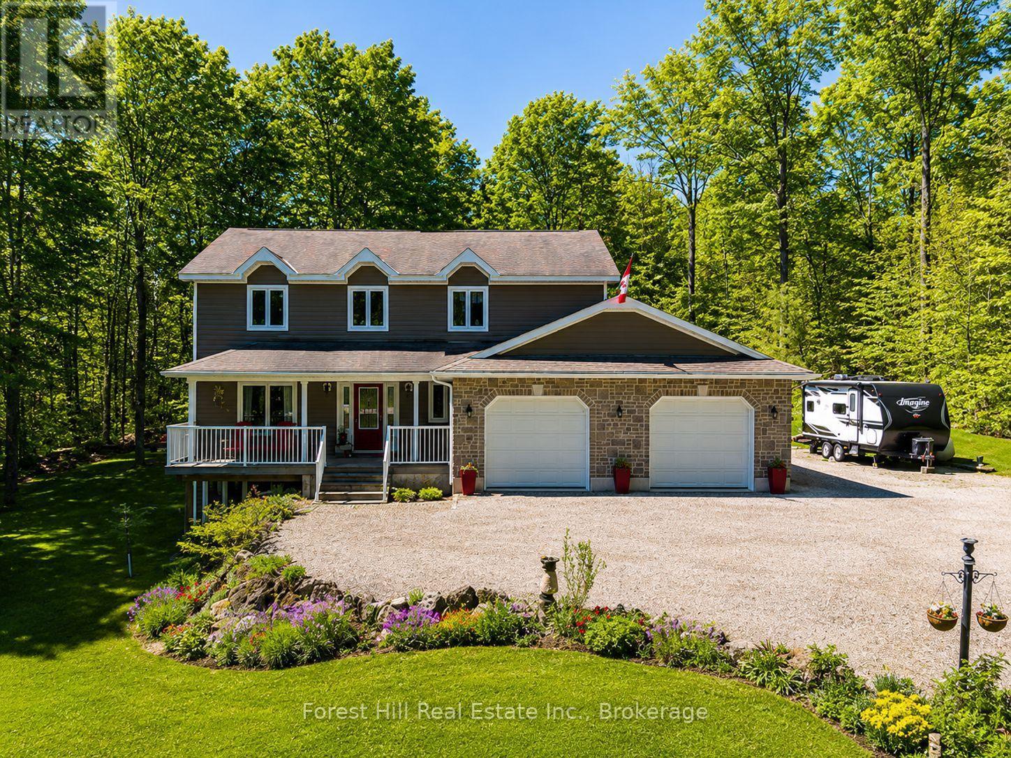 Beautiful home on a private estate lot - 157 Glen Fiddish Road, West Grey, ON - Outdoor With Deck Patio Veranda With Facade