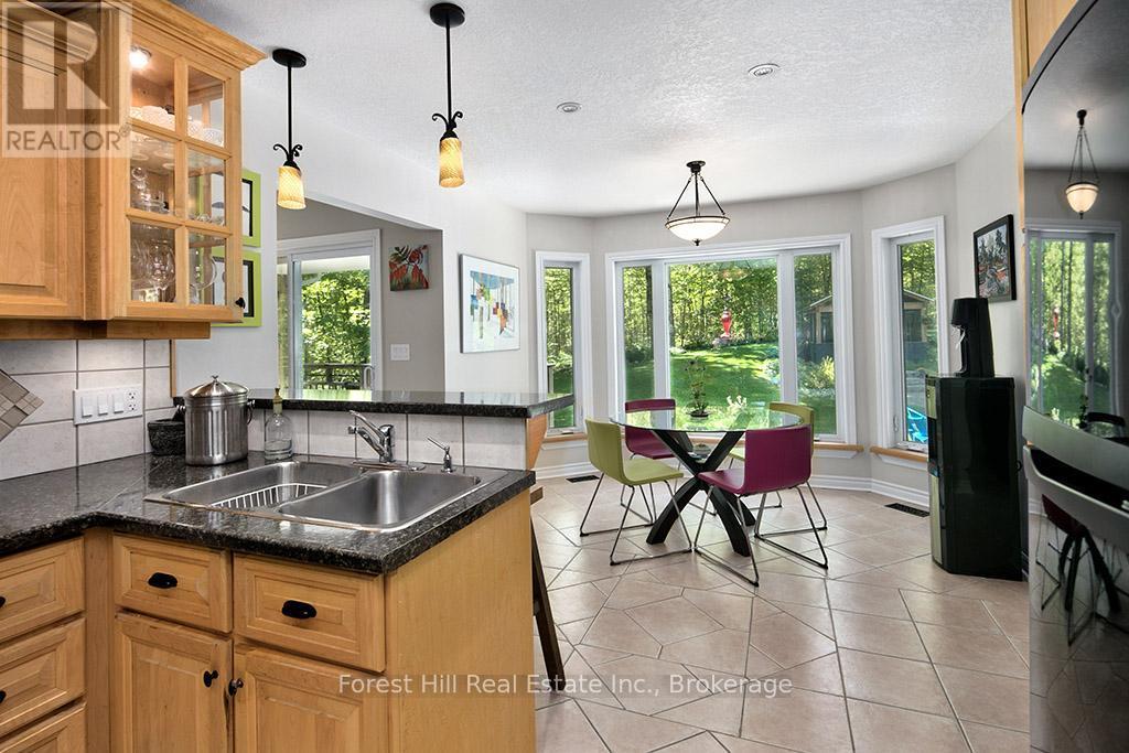 Kitchen & Breakfast Nook overlook back yard - 157 Glen Fiddish Road, West Grey, ON - Indoor Photo Showing Kitchen With Double Sink