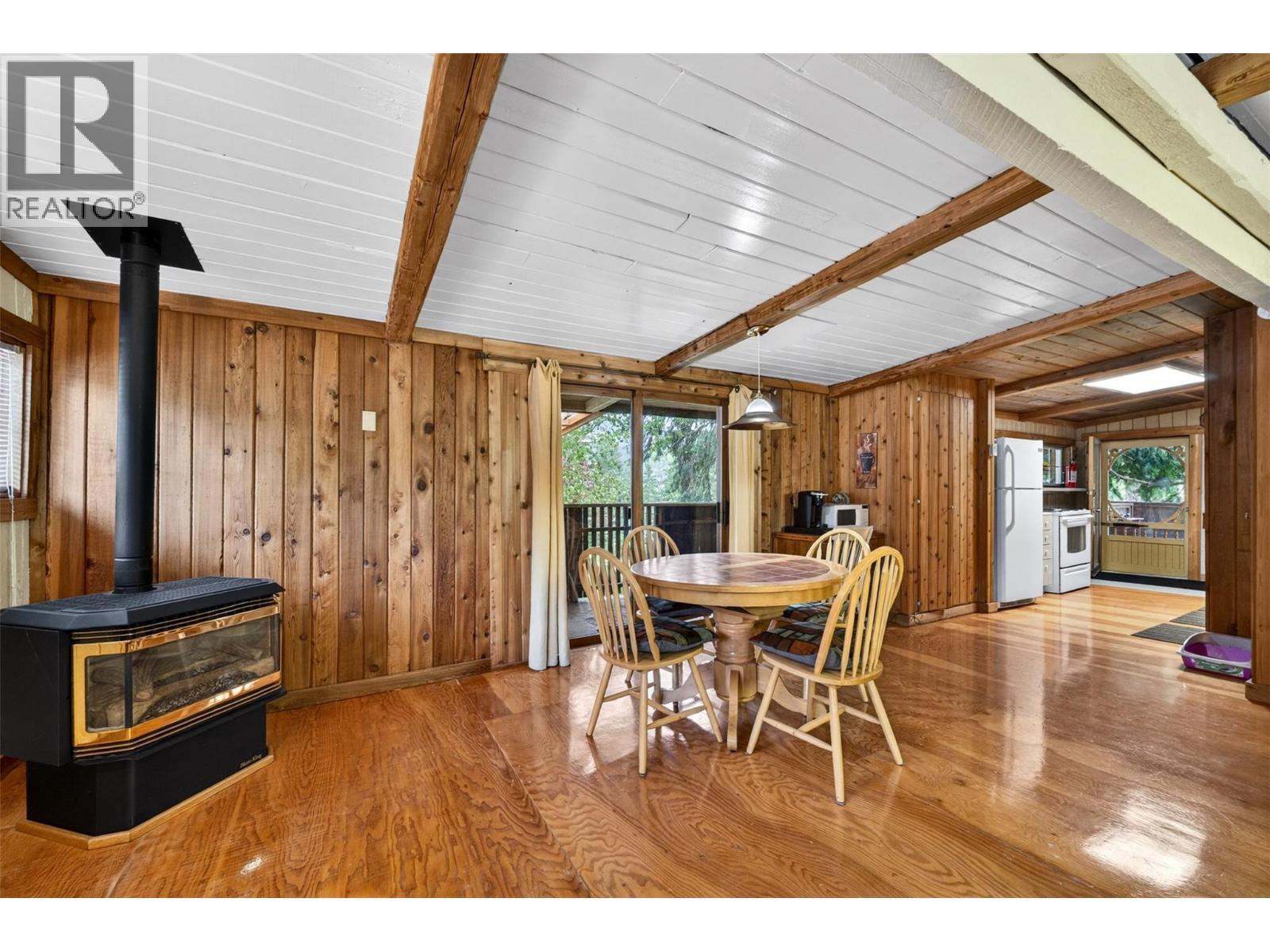 2030 Solsqua-Sicamous Road, Sicamous, BC - Indoor Photo Showing Dining Room With Fireplace