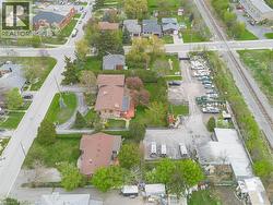 Aerial perspective highlighting the property's expansive lot, commercial-grade surface parking, and proximity to transportation infrastructure -