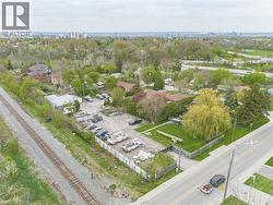 Expansive lot featuring a gravel surface, perimeter fencing, and direct road frontage -