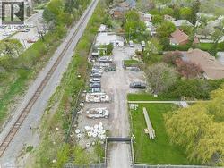 Expansive gravel lot with multiple vehicles and equipment -