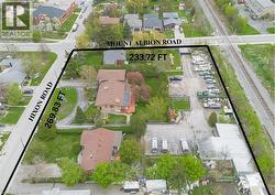 Expansive aerial view showcasing a large corner parcel with significant road frontage on Hixon Road and Mount Albion Road -