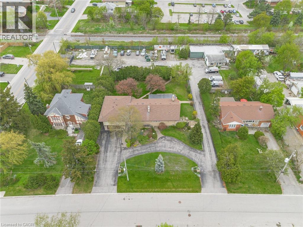 Spacious property featuring multiple structures, mature trees, and extensive paved driveways - 262-270-276 Hixon Road, Hamilton, ON