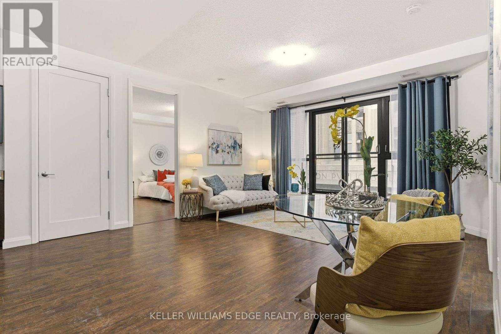 Bright open-concept living area with balcony - 408 - 112 King Street E, Hamilton, ON