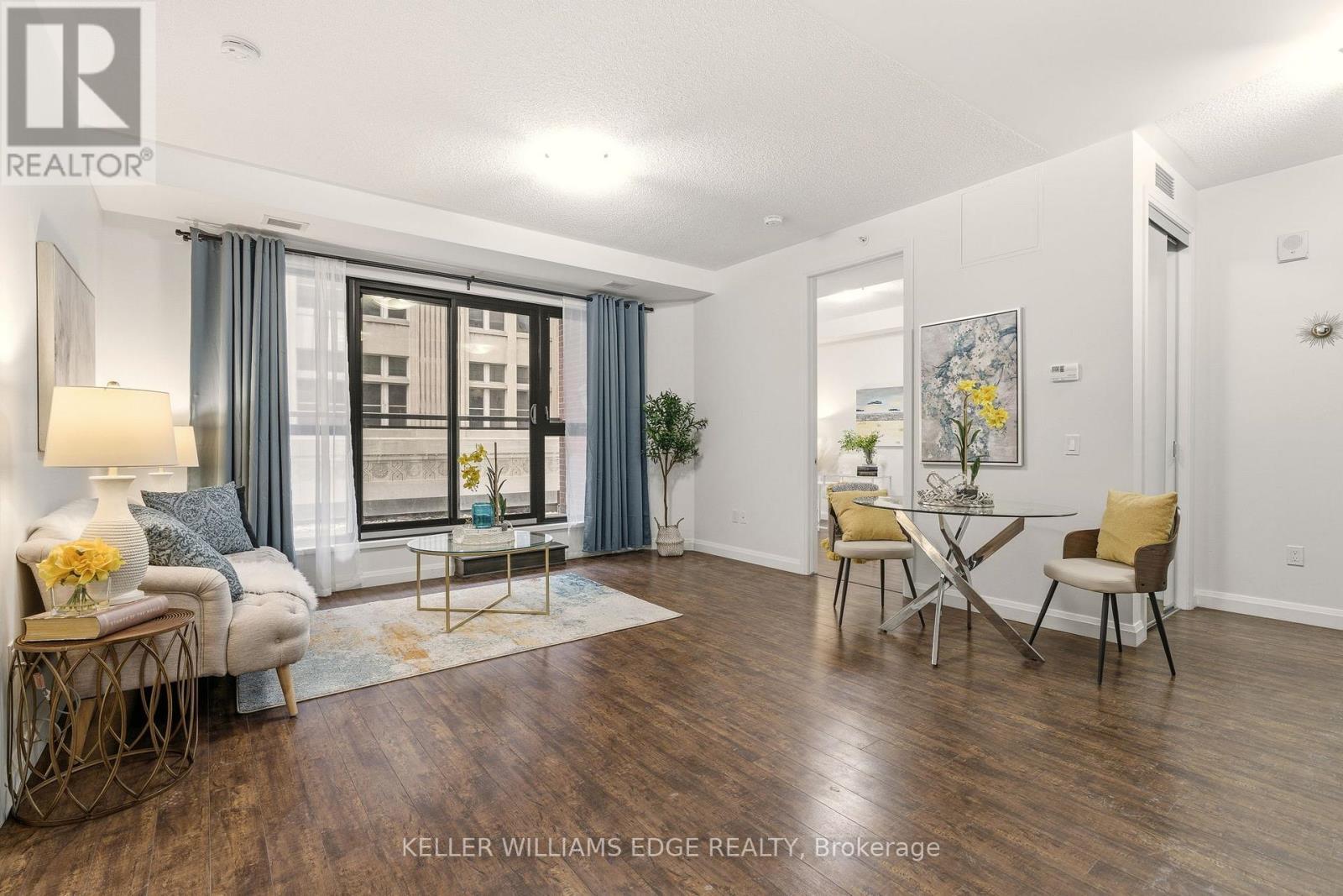 Bright open-concept living area with balcony - 408 - 112 King Street E, Hamilton, ON