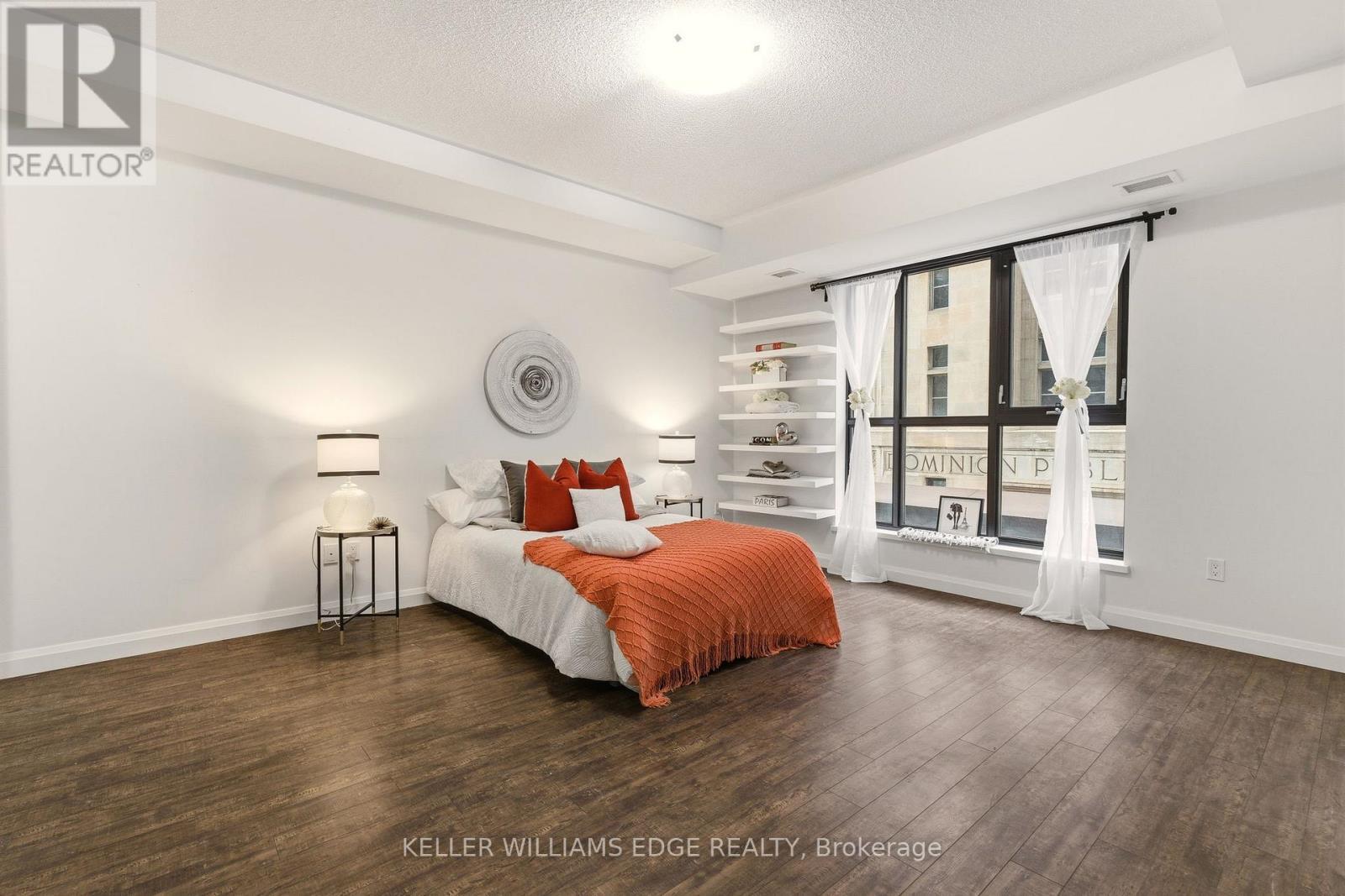 Spacious primary bedroom with large windows - 408 - 112 King Street E, Hamilton, ON