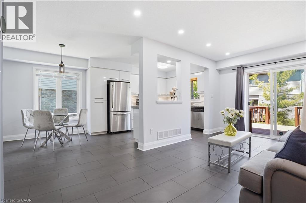 Open-concept living space with large format tile flooring and recessed lighting - 7 Upper Mercer Street Unit# G30, Kitchener, ON - Indoor Photo Showing Living Room