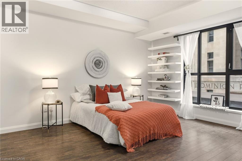 Spacious primary bedroom with large windows, 4PC Ensuite & Closet - 112 King Street E Unit# 408, Hamilton, ON