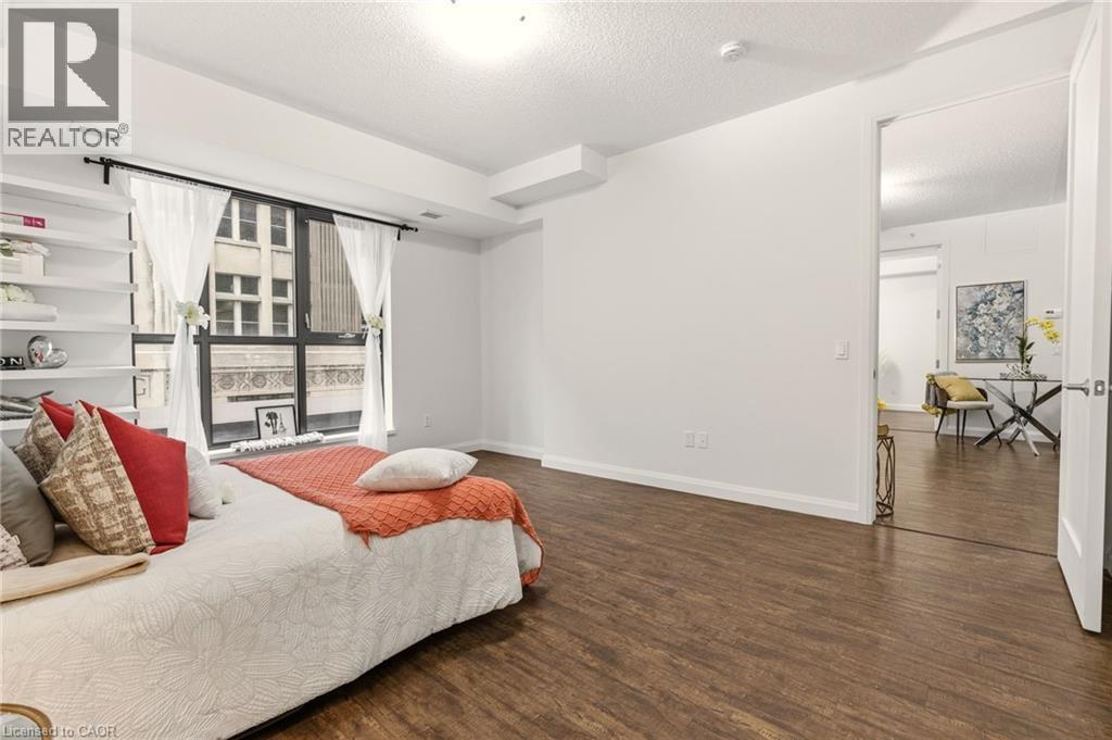 Spacious primary bedroom with large windows, 4PC Ensuite & Closet - 112 King Street E Unit# 408, Hamilton, ON