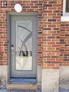 Entry door with decorative glass insert and smart lock -