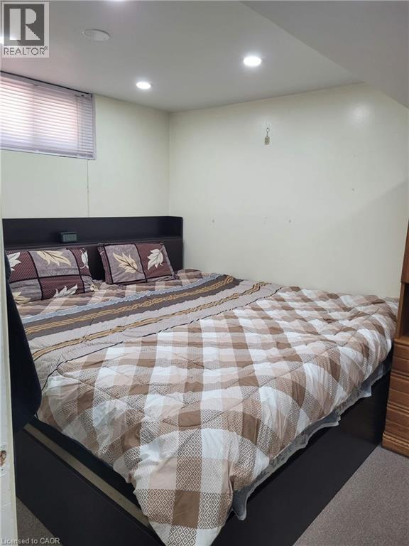 Recessed ceiling lighting illuminates this room, featuring light-toned walls and carpet flooring - 153 Arnold Street, Kitchener, ON