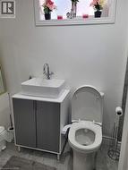 Contemporary vanity with a rectangular vessel sink and chrome faucet -