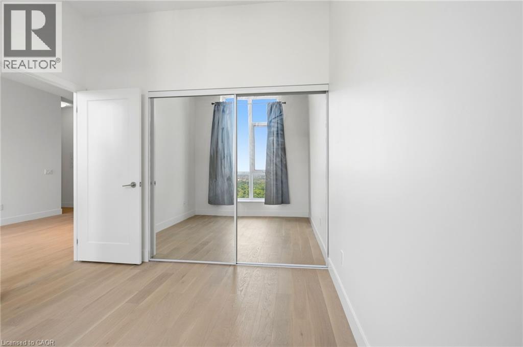 Room featuring expansive mirrored closet doors - 7 Mabelle Avenue Unit# Ph07, Toronto, ON