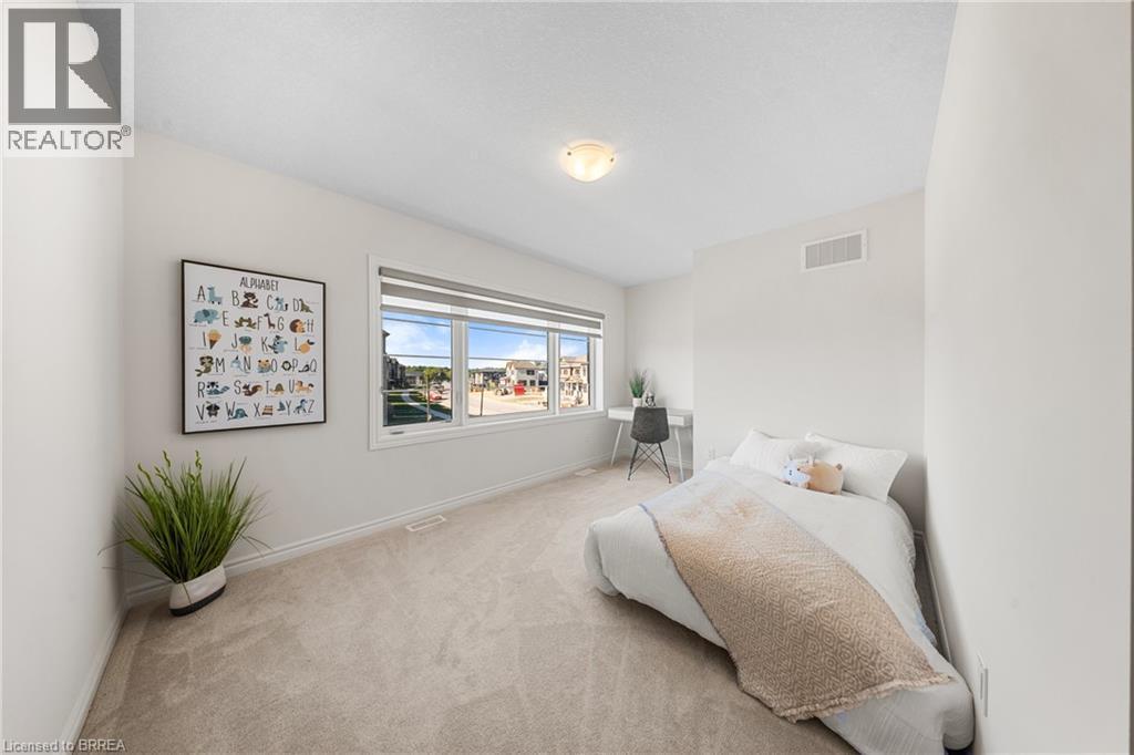 Carpeted bedroom with baseboards - 1 Bee Crescent, Brantford, ON