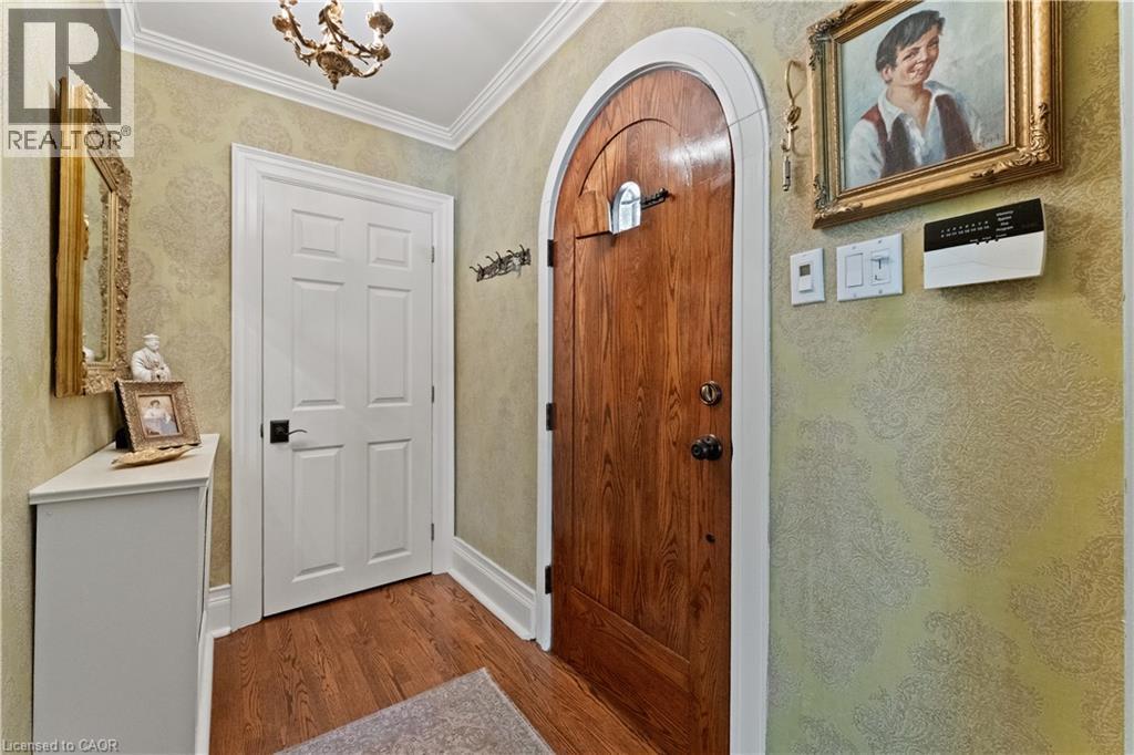 Front Entry. Solid custom door with speakeasy. - 3040 First Street, Burlington, ON - Outdoor