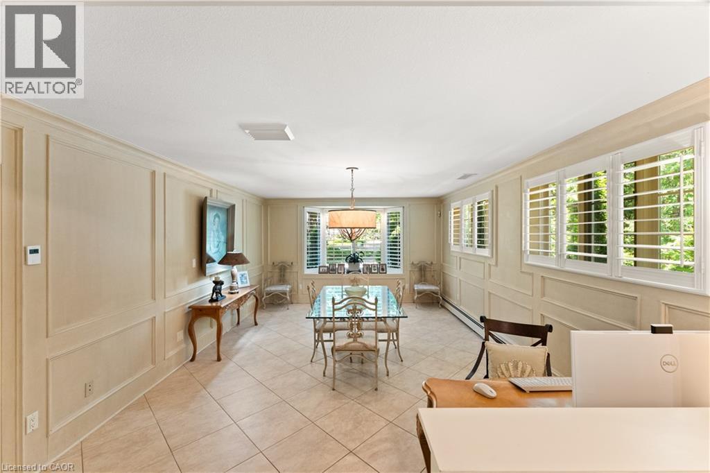 Currently used as a breakfast room and office. Originally a family room. Heated floors. Plantation shutters. California knock-back ceiling. Adjoins kitchen. - 3040 First Street, Burlington, ON - Indoor Photo Showing Bedroom