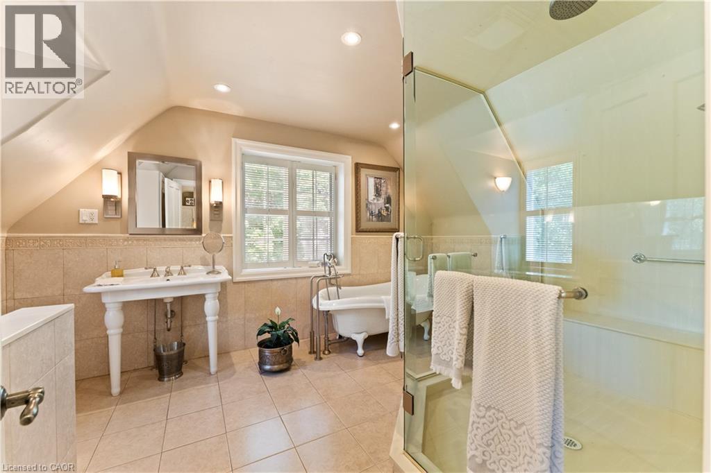 2 double closets, California shutters, built in vanity. Hand scraped dark maple flooring. - 3040 First Street, Burlington, ON - Indoor Photo Showing Bedroom