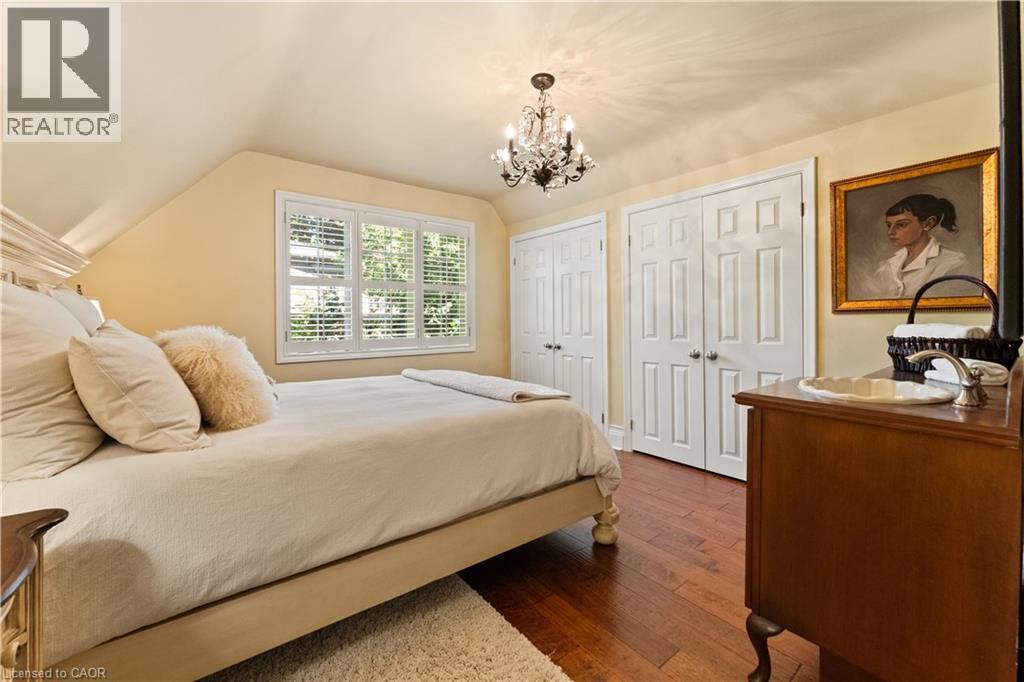 Walk-in closet. California shutters - 3040 First Street, Burlington, ON - Indoor Photo Showing Bedroom
