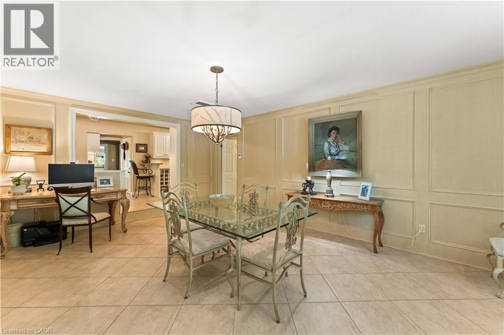 Currently used as an informal dining area and office. Heated flooring. High end fixture. Plantation shutters. Adjoins kitchen and mudroom. - 3040 First Street, Burlington, ON - Indoor Photo Showing Dining Room