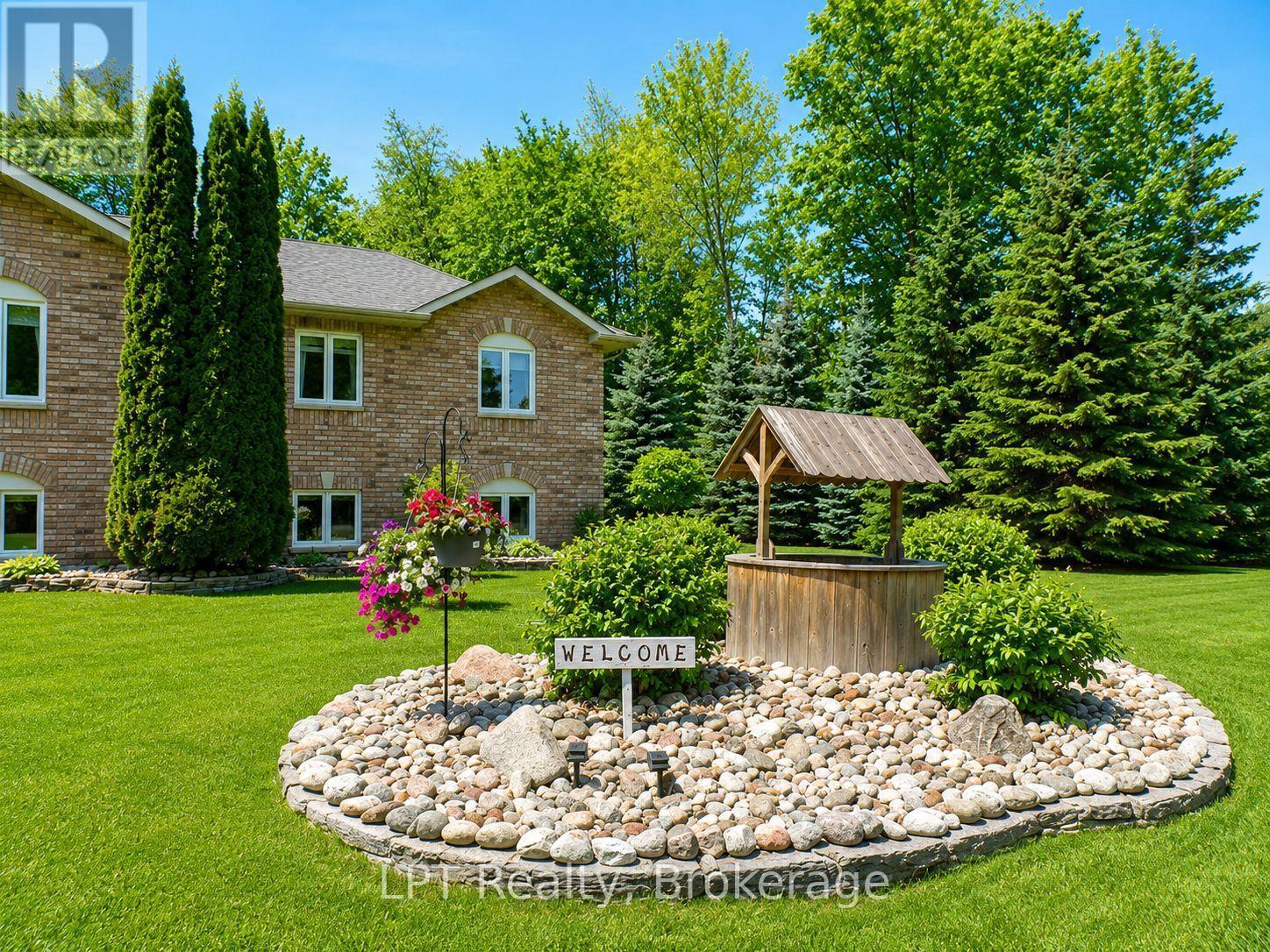 Front Landscaped Rock Garden With Wishing Well - 10 Vicari Road, Brighton, ON