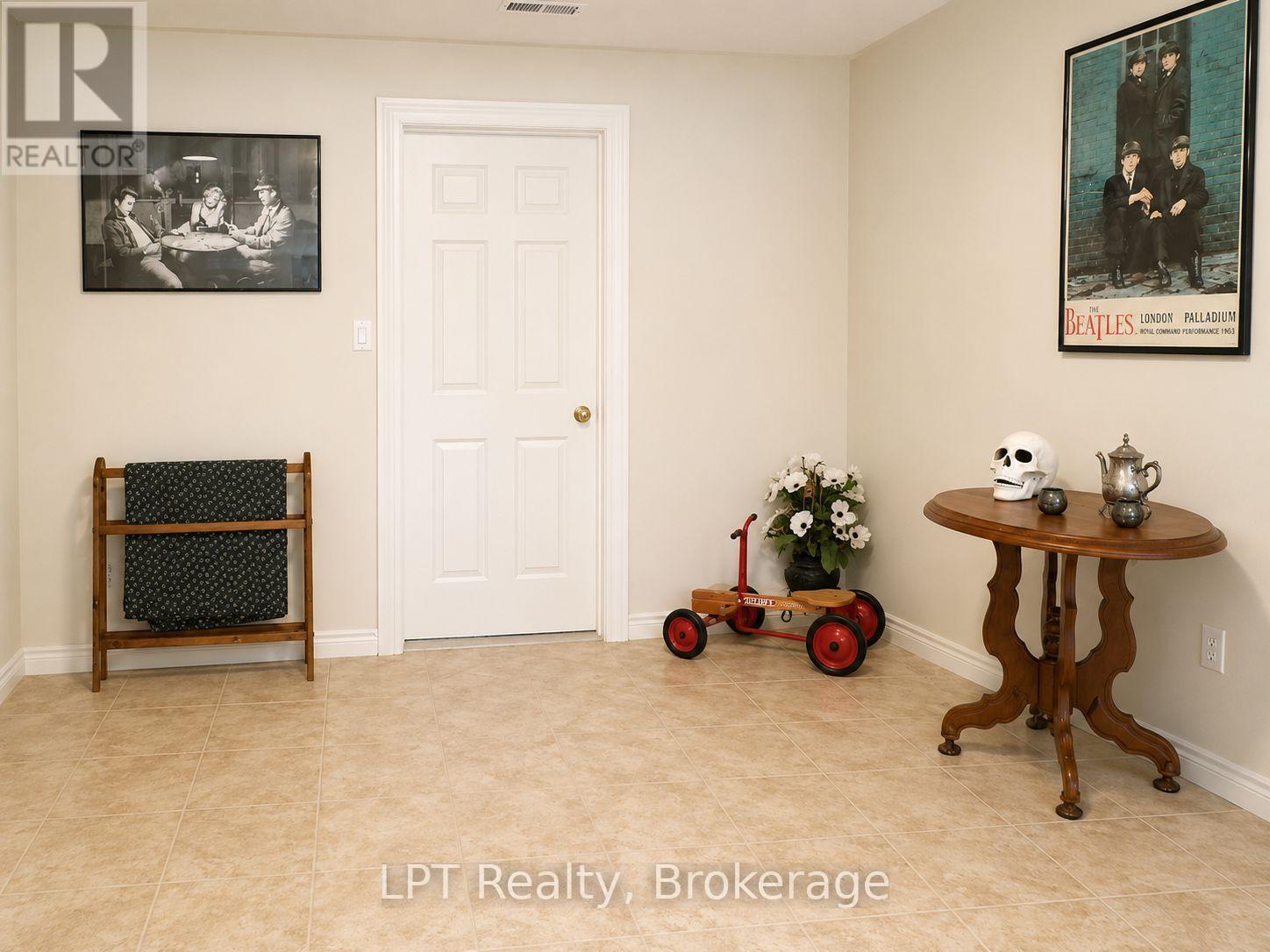 Lower Level Family Room With Cozy Gas Fireplace - 10 Vicari Road, Brighton, ON