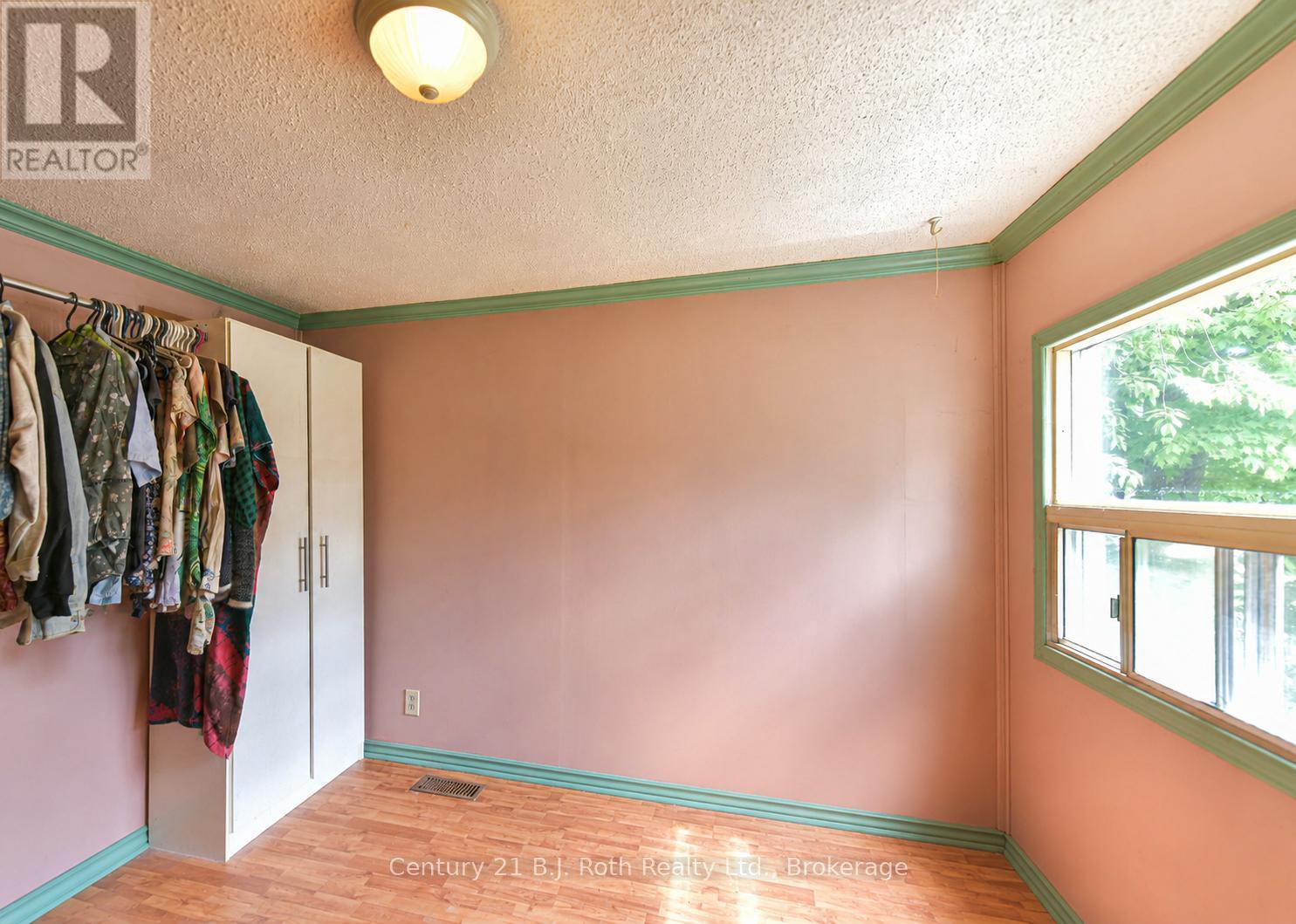 Large window in 2nd Bedroom (AI enhanced) - 3427 Coronation Avenue, Severn (West Shore), ON