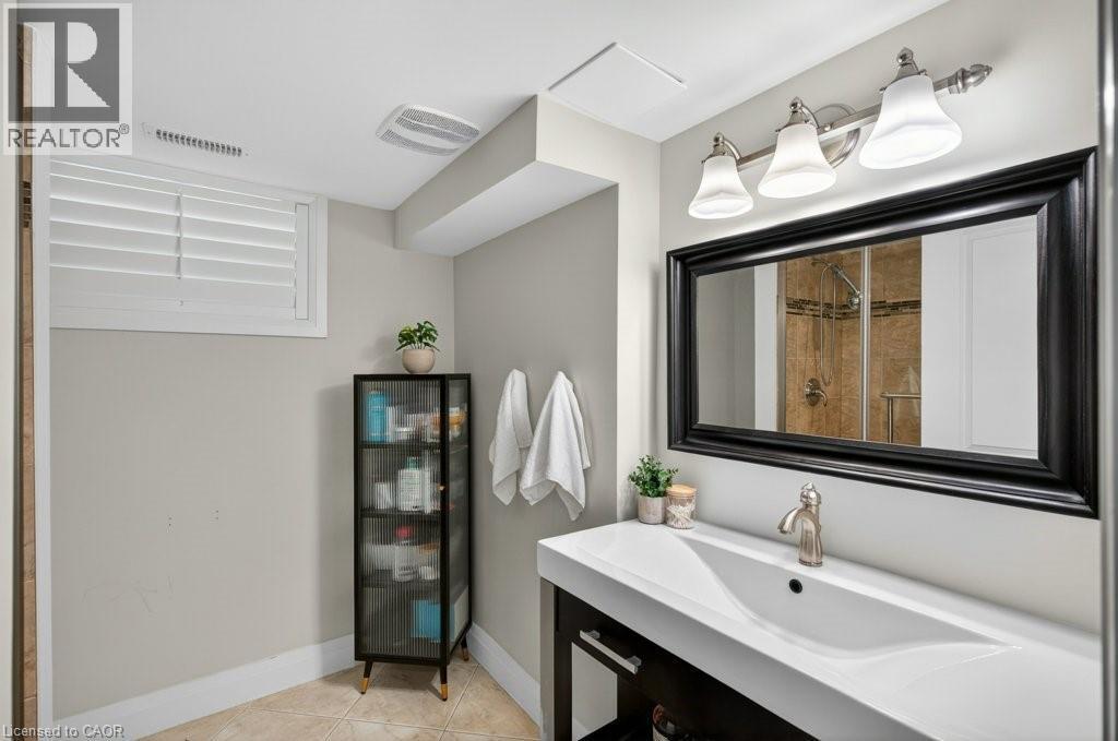Contemporary vanity with an integrated sink and brushed nickel faucet - 603 Cornick Drive, Burlington, ON