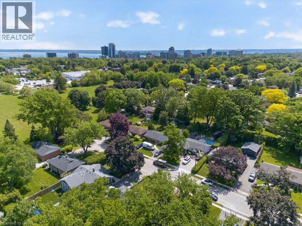 Expansive aerial perspective showcasing a residential neighborhood with mature trees - 603 Cornick Drive, Burlington, ON