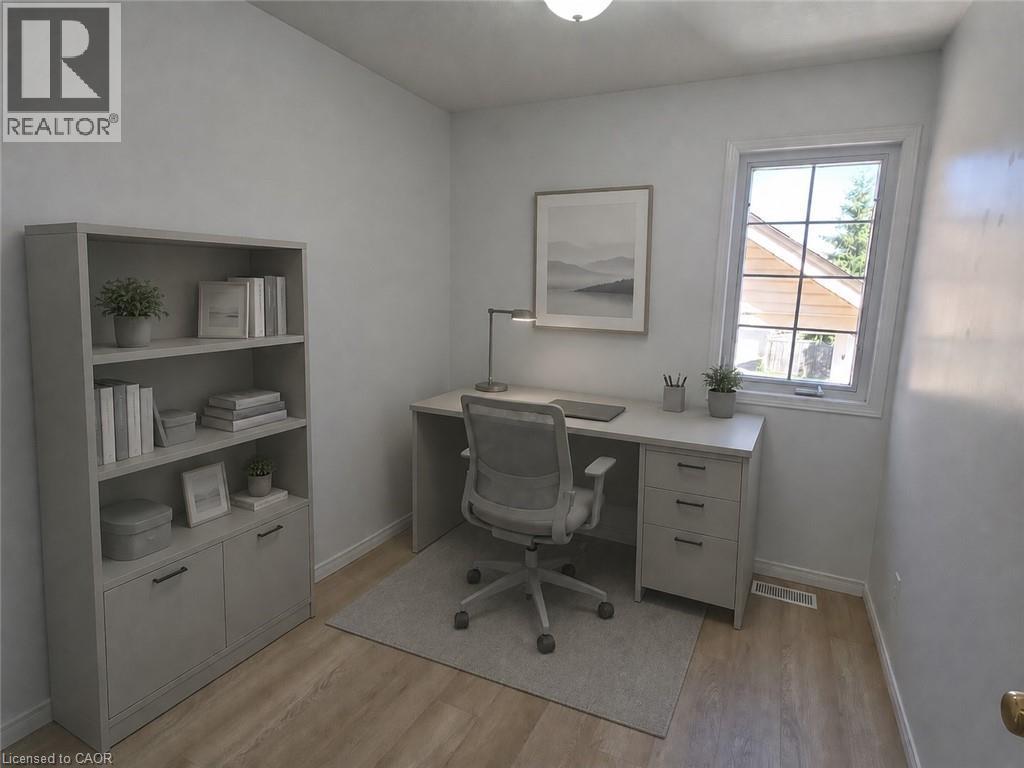 Dedicated room featuring light wood-finish flooring, white walls, and a large window with white trim - 390 Wake Robin Crescent, Kitchener, ON - Indoor Photo Showing Office
