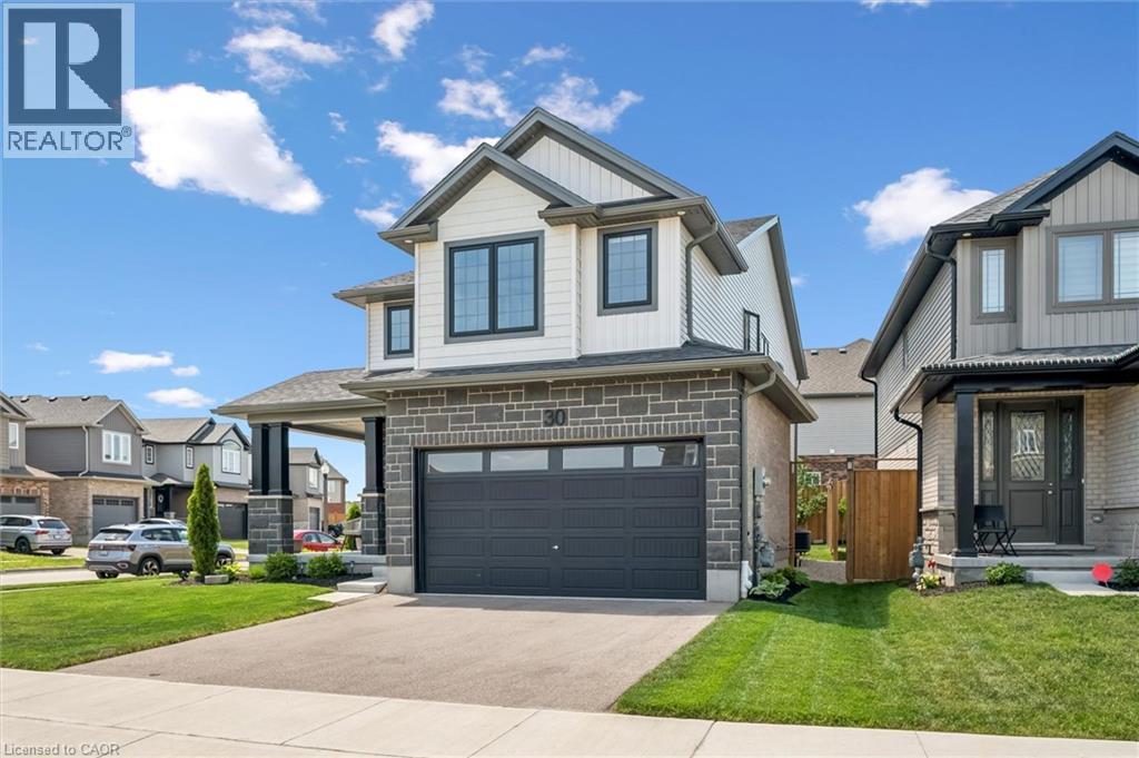 Contemporary two-story residence featuring a stone and siding exterior - 30 Waterbow Trail, Kitchener, ON - Outdoor With Facade