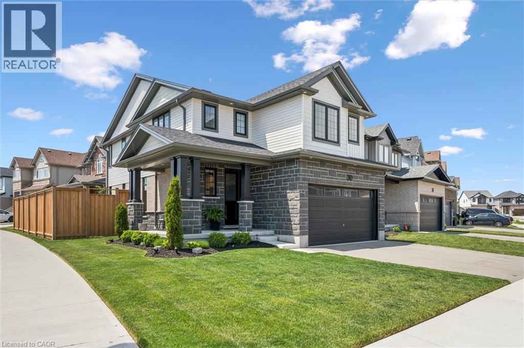 Contemporary two-story exterior featuring stone veneer and horizontal siding - 30 Waterbow Trail, Kitchener, ON - Outdoor With Facade