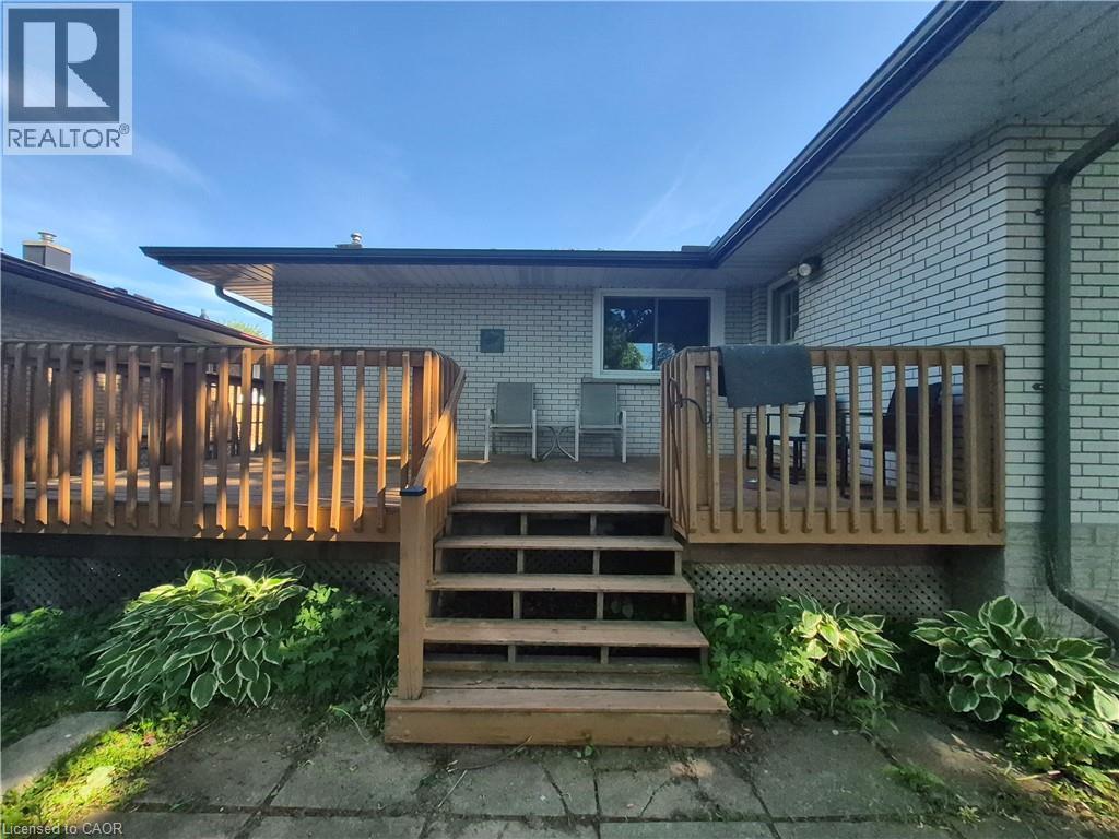 Multi-level wood deck with a full staircase, offering direct access to the exterior - 11 Duncairn Avenue, Kitchener, ON