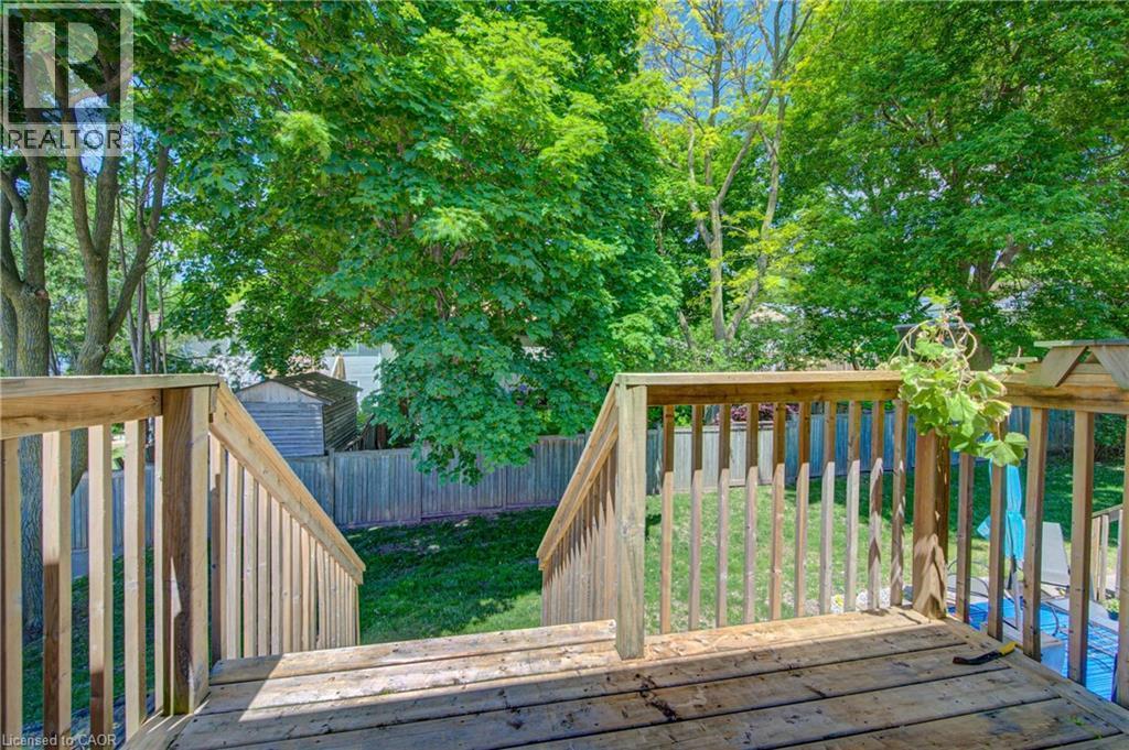 Private setting backing onto private homes with tree buffer - 375 Holiday Inn Drive Unit# 9, Cambridge, ON - Outdoor With Deck Patio Veranda