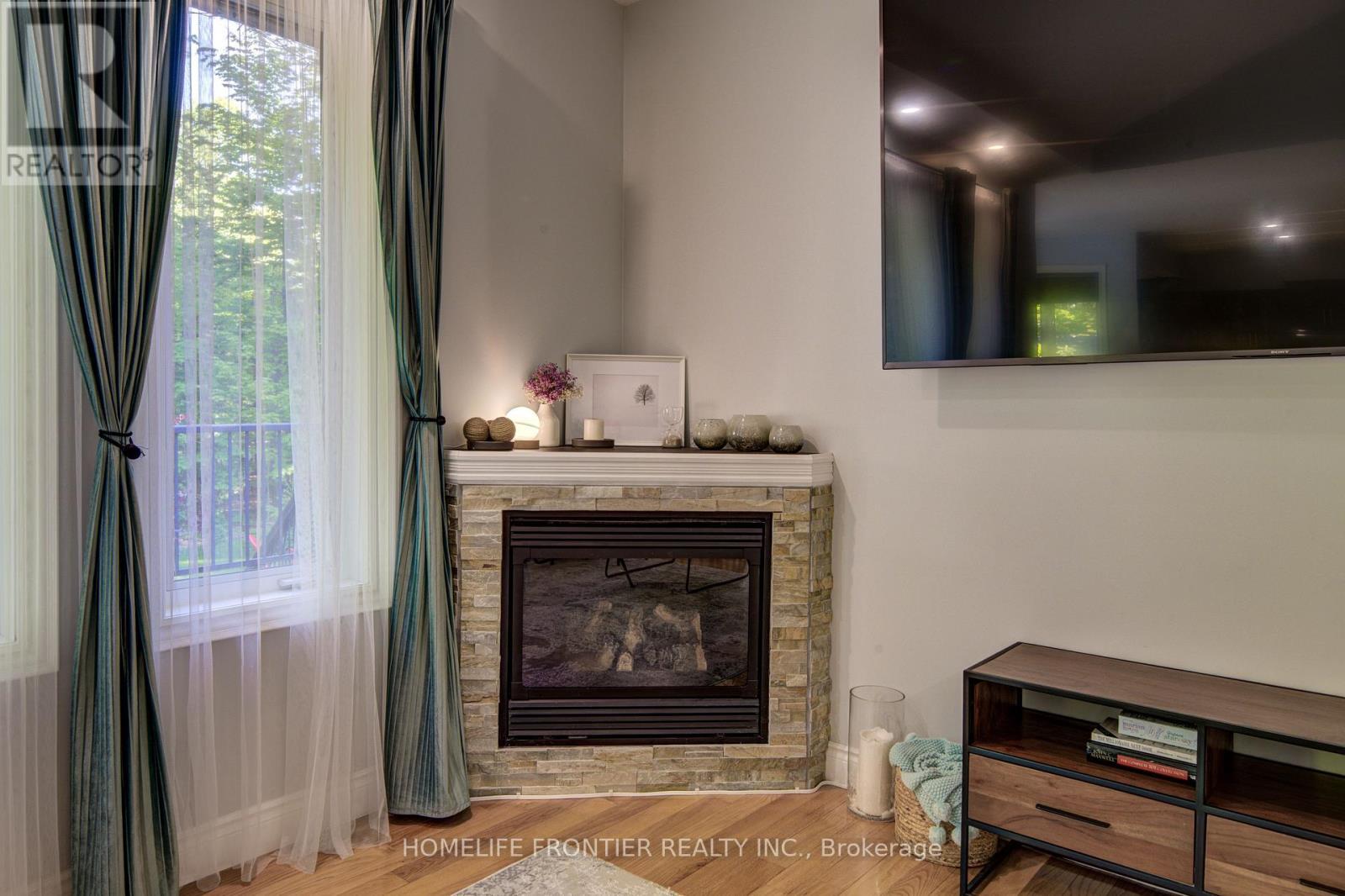 42 Forest Circle, Tiny, ON - Indoor Photo Showing Living Room With Fireplace
