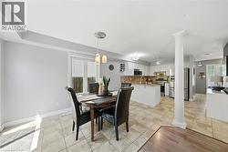 Open-concept kitchen and dining area featuring tile flooring -